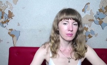 Ukrainian MILF fondles shaved pussy on webcam